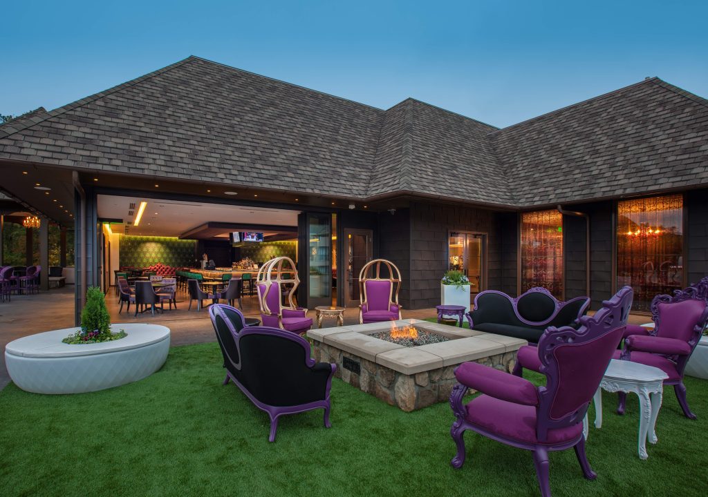 Grand Bohemian Hotel Mountain Brook rooftop bar with purple furniture