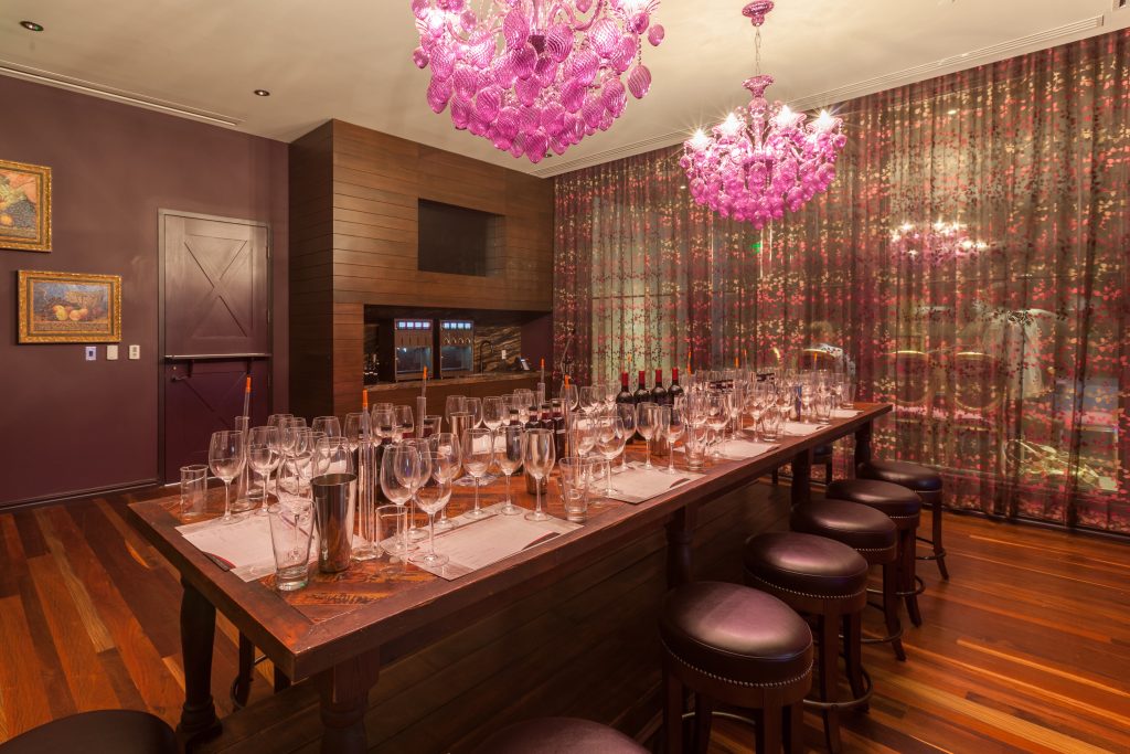 Grand Bohemian Hotel Mountain Brook's wine blending room with purple glass chandeliers