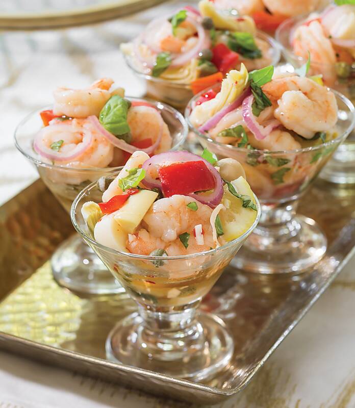 Elegant Pickled Shrimp served in small glass cups on a metal tray