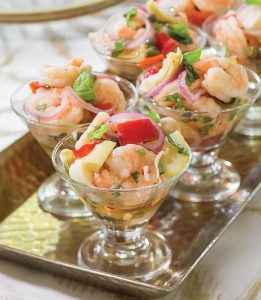 Elegant Pickled Shrimp in small glass cups on a metal tray