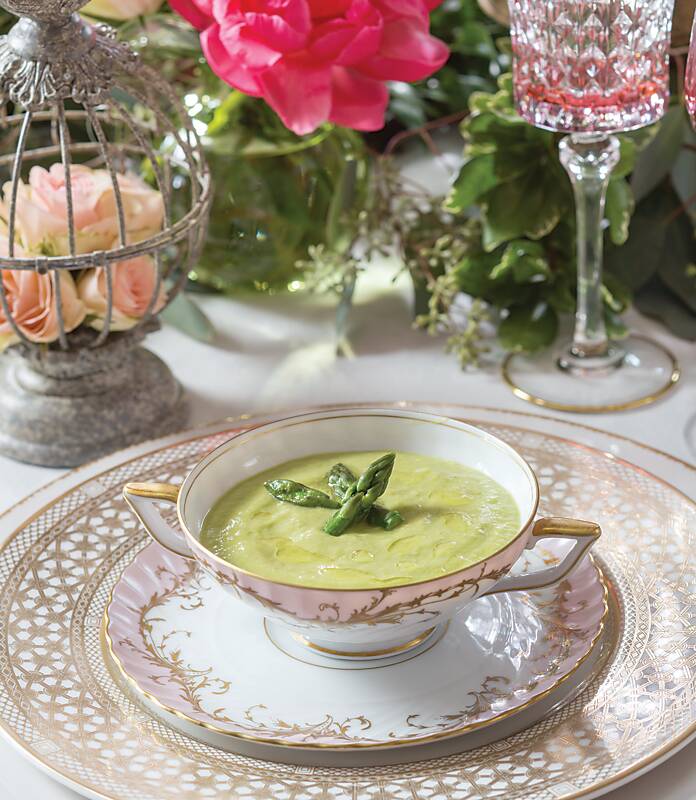 Asparagus-Avocado Bisque served in a fine china cup and saucer