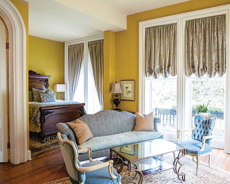 A suite with yellow walls at Hamilton-Turner Inn