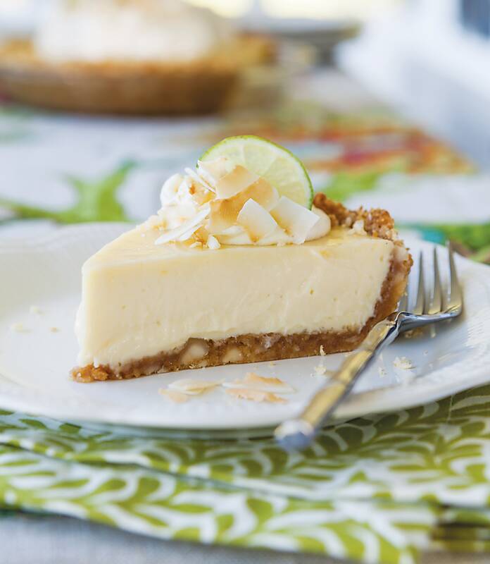 A slice of Tropical Key Lime Pie on a white plate