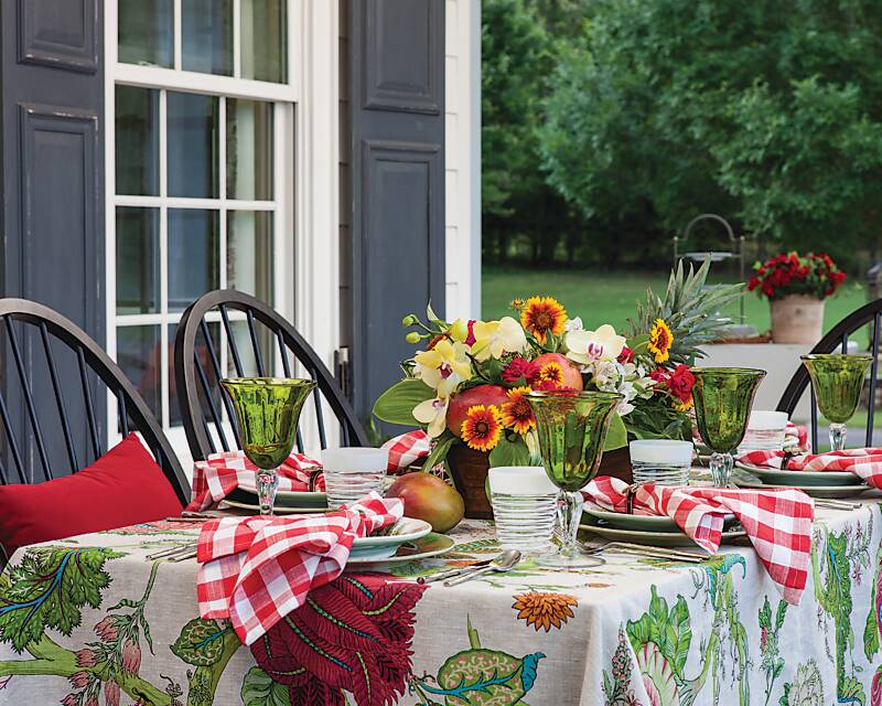 Taste of the Tropics porchside table set with shades of green, red, and white