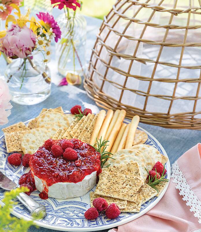 Warm Brie with Raspberry Pepper Jelly and assorted crackers