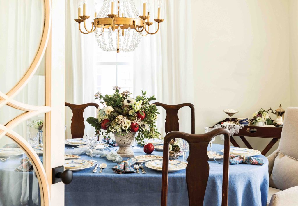 Dining table covered in a blue linen, featured on the September 2022 issue of Southern Lady magazine