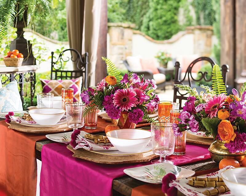 Faraway Flair tablescape with bright pink and orange details