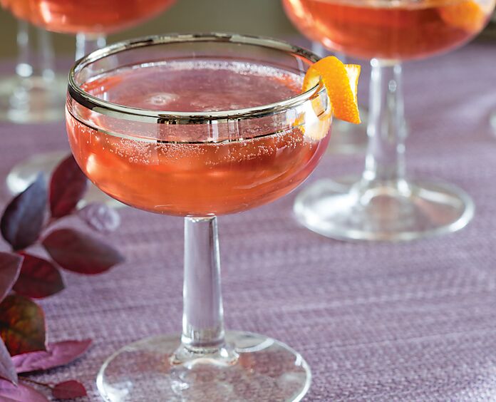 St-Germain Sparkler in a coupe glass garnished with an orange curl