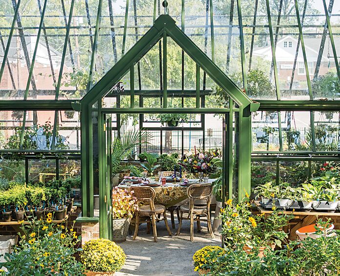 A greenhouse gathering within a green-and-glass greenhouse